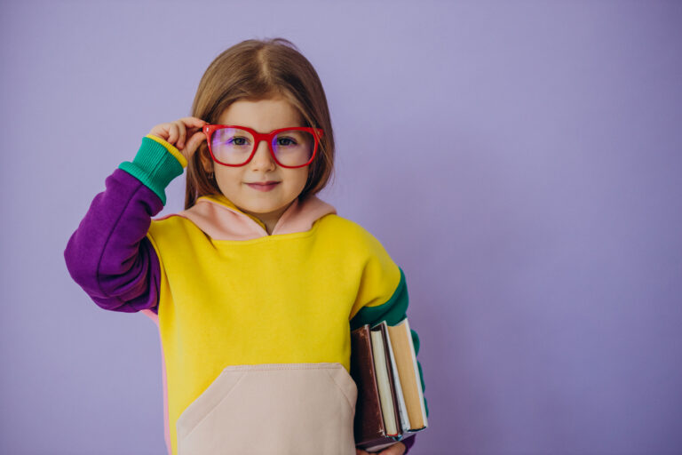 cute little girl holding books isolated studio